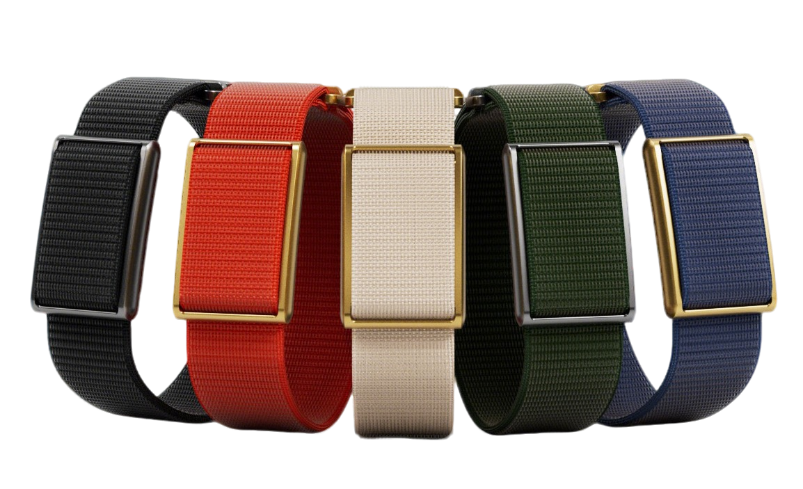 Four woven fabric watch straps in black, red, cream, and green, paired with rectangular gold-tone metal cases, arranged side by side on a white background.